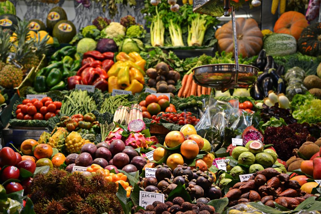 Rows of fresh, colorful vegetables and fruits at the supermarket