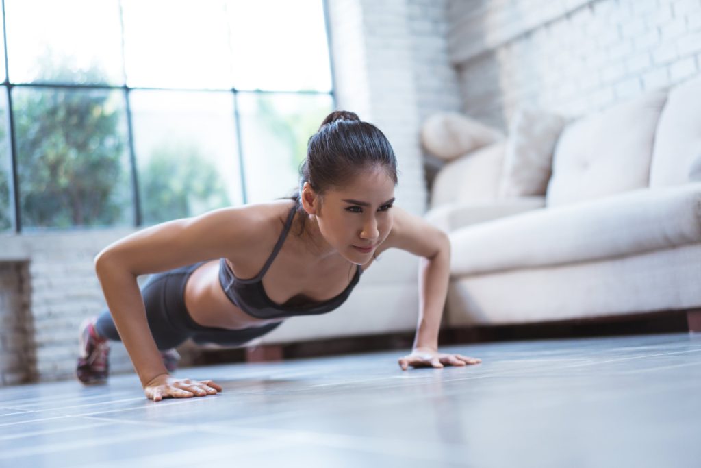 woman doing an upper body workout at home